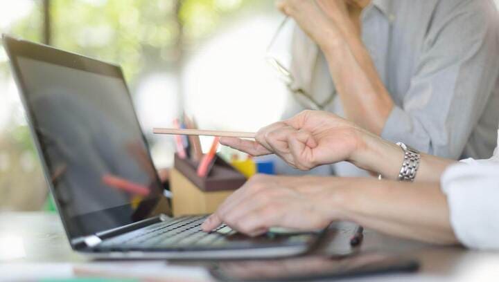 Image to two people discussing spam traps and catch-all email lists. 