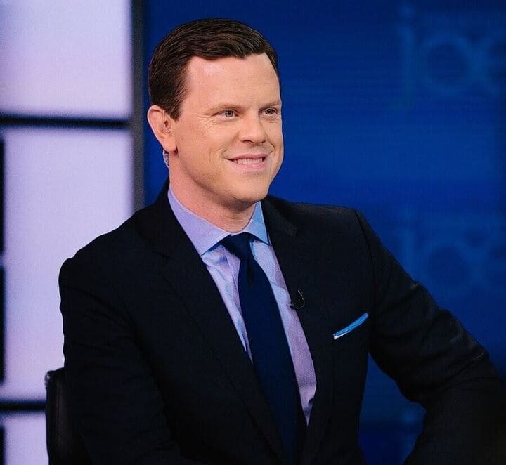 Photo of journalist Willie Geist wearing suit and tie.