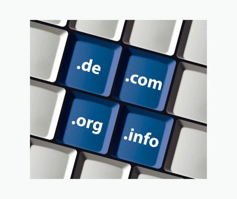 Light gray keyboard shows blue keys with various domain extensions
