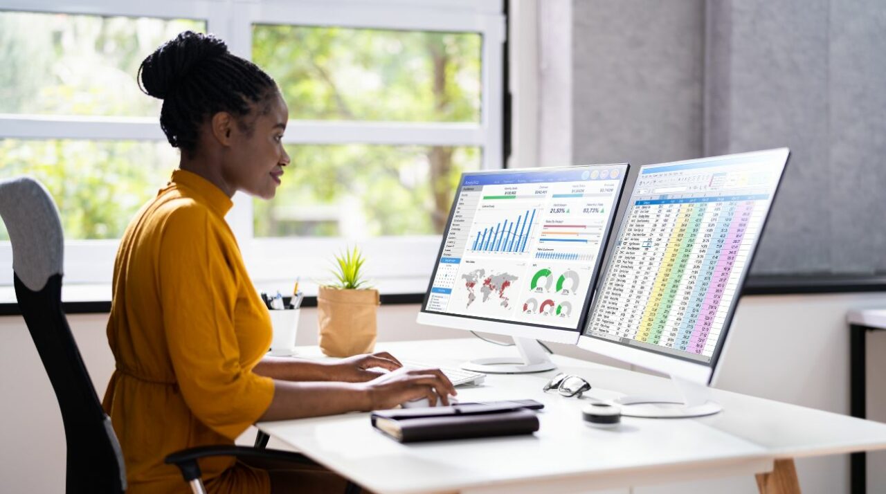 African-American woman working on computer to integrate GetResponse with ZeroBounce and social media