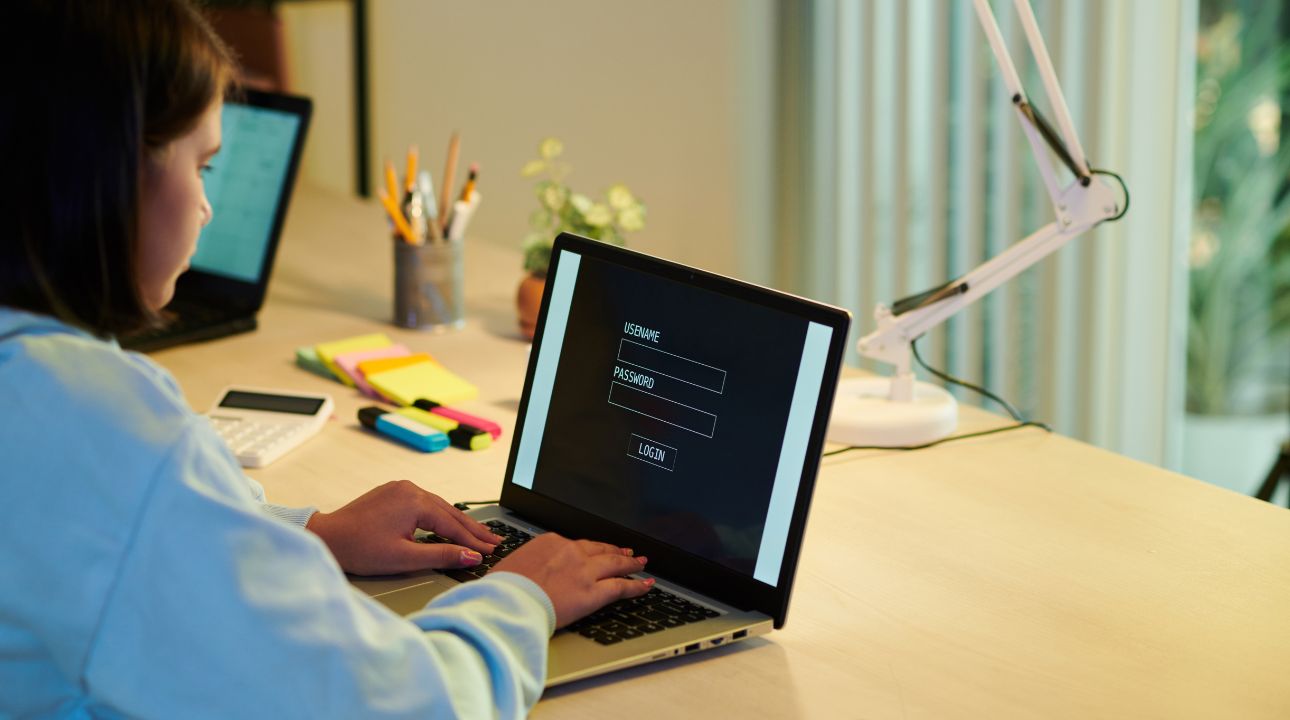 woman typing password on computer to illustrate zerobounce's study on the countries with the most vulnerable passwords