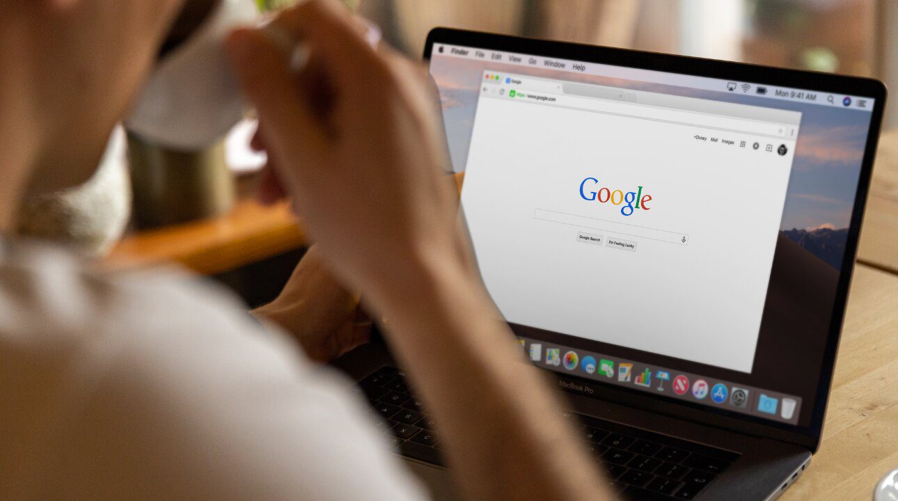 Google user looks over laptop before deciding to finally change gmail address.